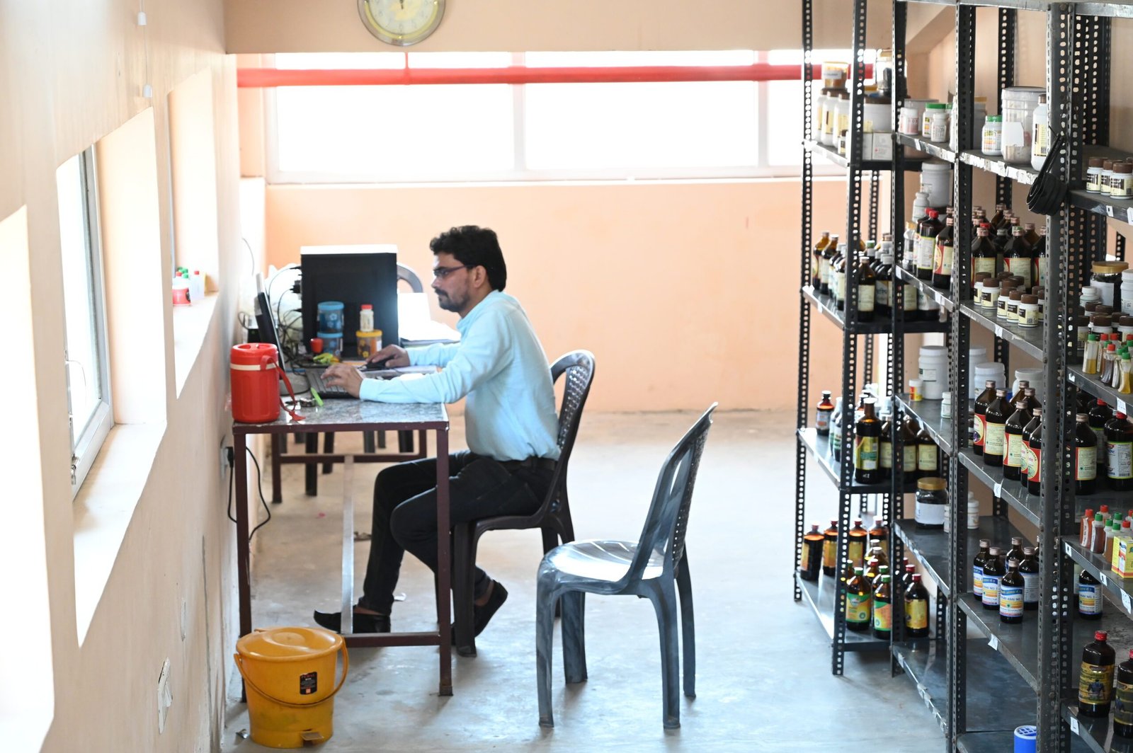 Faculty member working in a pharmacy lab at an Ayurvedic PG college in UP.